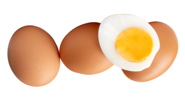 Top view of raw chicken eggs and cooked or boiled chicken egg with egg yolk in half in pile or stack isolated with clipping path in file format png