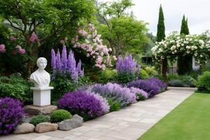Blooming delphiniums and roses decorating a formal garden with a bust photo