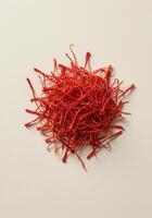 A beautiful pile of saffron threads ready to be used in cooking. photo