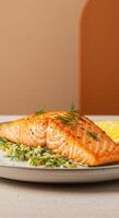Grilled salmon with lemon and dill on a plate photo
