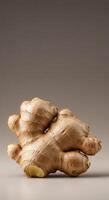 Fresh ginger root isolated on a neutral background photo