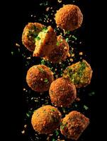 Crunchy Falafel Pieces Captured In The Air photo