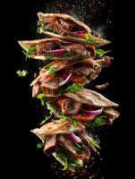 Falling Pita Bread And Delicious Gyro Meat photo
