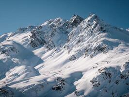 A Chain Of Mountains Covered In A New Layer Of Snow photo