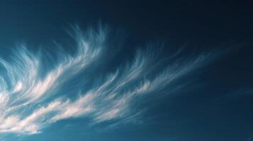 A Colorful Wispy Cloud In The Sky Shaped Like A Feather photo