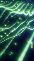 Abstract green light streams with colorful glowing particles on a dark background, creating a dynamic flow effect video