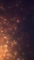 Abstract golden particles floating in warm atmosphere, creating a dreamy glowing bokeh effect video