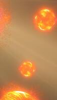 Abstract glowing orange spheres radiating energy and surrounded by floating particles in a cosmic scene video