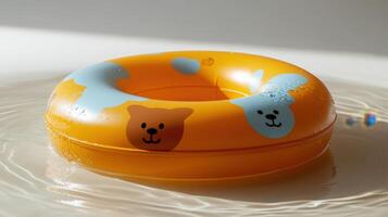 A toy ring floating in water with a bear on it photo