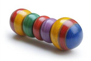 A wooden toy with a rainbow colored top photo