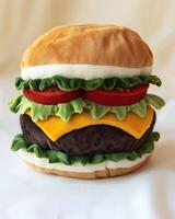 A stuffed hamburger on a white background photo
