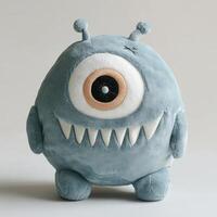 A stuffed monster with big eyes and a big nose photo