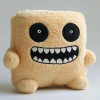 A stuffed animal with a big mouth and teeth photo