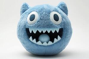 A blue monster plush toy with teeth and eyes photo