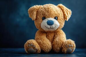 A teddy bear with blue eyes sitting on a dark background photo