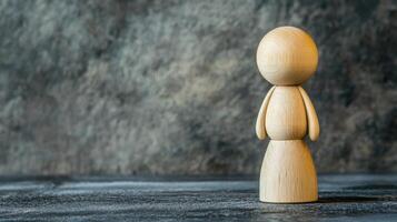 Wooden figurine on dark background photo