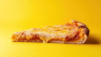 Pizza slice on yellow background photo