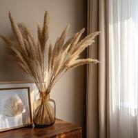 Arrangement of pampas grass in a glass vase in a room photo