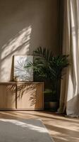 Light streams into the room illuminating art and plant photo