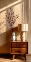 Still life with lamp and vase on wooden bedside table photo