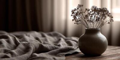 Still life with dried flowers in vase on wooden surface photo