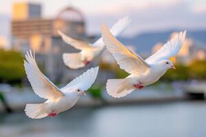 White doves gracefully soar through the air, wings outstretched, against a serene backdrop of soft colors and blurred cityscape, symbolizing peace and hope in a tranquil setting photo