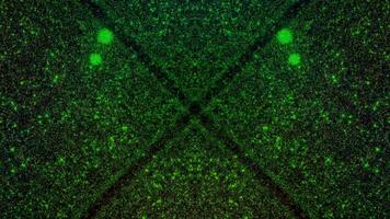 Abstract dynamic particle field animation featuring glowing green and yellow particles moving through a dark, textured space with a video