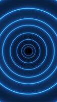 Vertical blue neon circle background animation zooming in. Looping motion design video