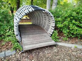 Wicker tunnel at park playground photo