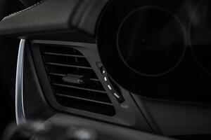 Interior View of a Modern Car Dashboard Highlighting Air Vent Design and Control photo