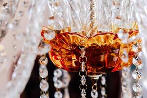 Elegant glass chandelier highlighting intricate design and craftsmanship in an indoor setting photo