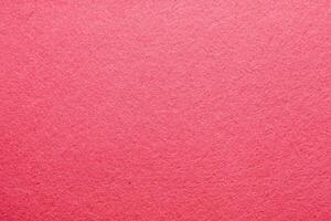 Textured pink surface creates a vibrant backdrop for artistic projects or crafts photo