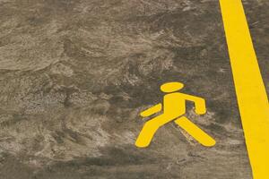Walking path marking on concrete surface in urban area during daylight hours photo