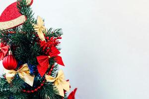 Christmas tree decorations in vibrant red and gold hues create a festive atmosphere photo
