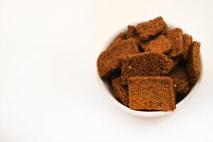 Spicy and salty crackers in cups. Food and snacks.Bread snacks. photo