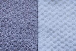 Terry cloth towels with visible loops. Background of colorful towels. Several soft terry towels. photo