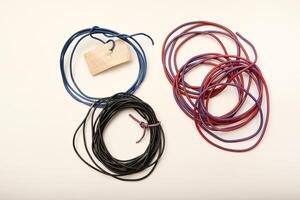 Bundles of copper connecting wires in rubber insulation. Multicolored wires. photo