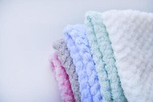 Soft pastel towels neatly arranged. Multi-colored pile towels. A soft towel. photo