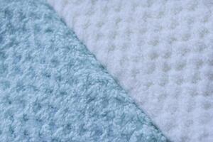 Color-blocked towel display. Background of colorful towels. Several soft terry towels. photo
