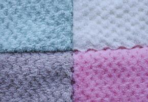 Boho-style striped towels close-up. Background of colorful towels. Several soft terry towels. photo
