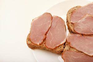 Healthy whole-grain sandwich with lean turkey slices.Ham sandwiches. Ham cut into thin slices. photo