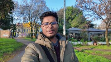 Person vlog with a camera moving hand and walking in a turist city video
