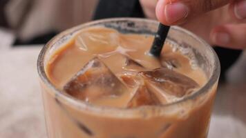 Enjoying iced coffee on a warm day at a cafe video