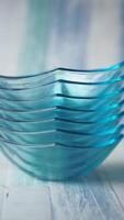 Stack of elegant blue glass bowls arranged neatly video