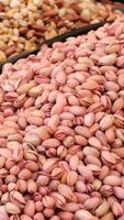 Pistachio nuts displayed in an open market video