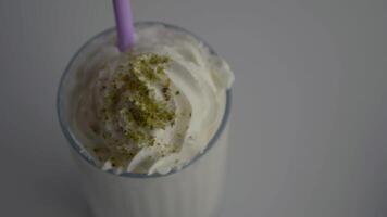 Delicious milkshake topped with whipped cream and nuts video