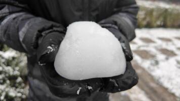 Snowball creation in a winter landscape during daytime video