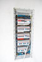 Open Electrical Panel with Circuit Breakers and Color Coded Wiring photo