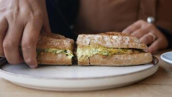 Delicious sandwich preparation in cozy cafe setting video