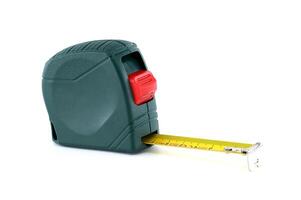 A green and red measuring tape extends on a white background, perfect for precise measurements. photo